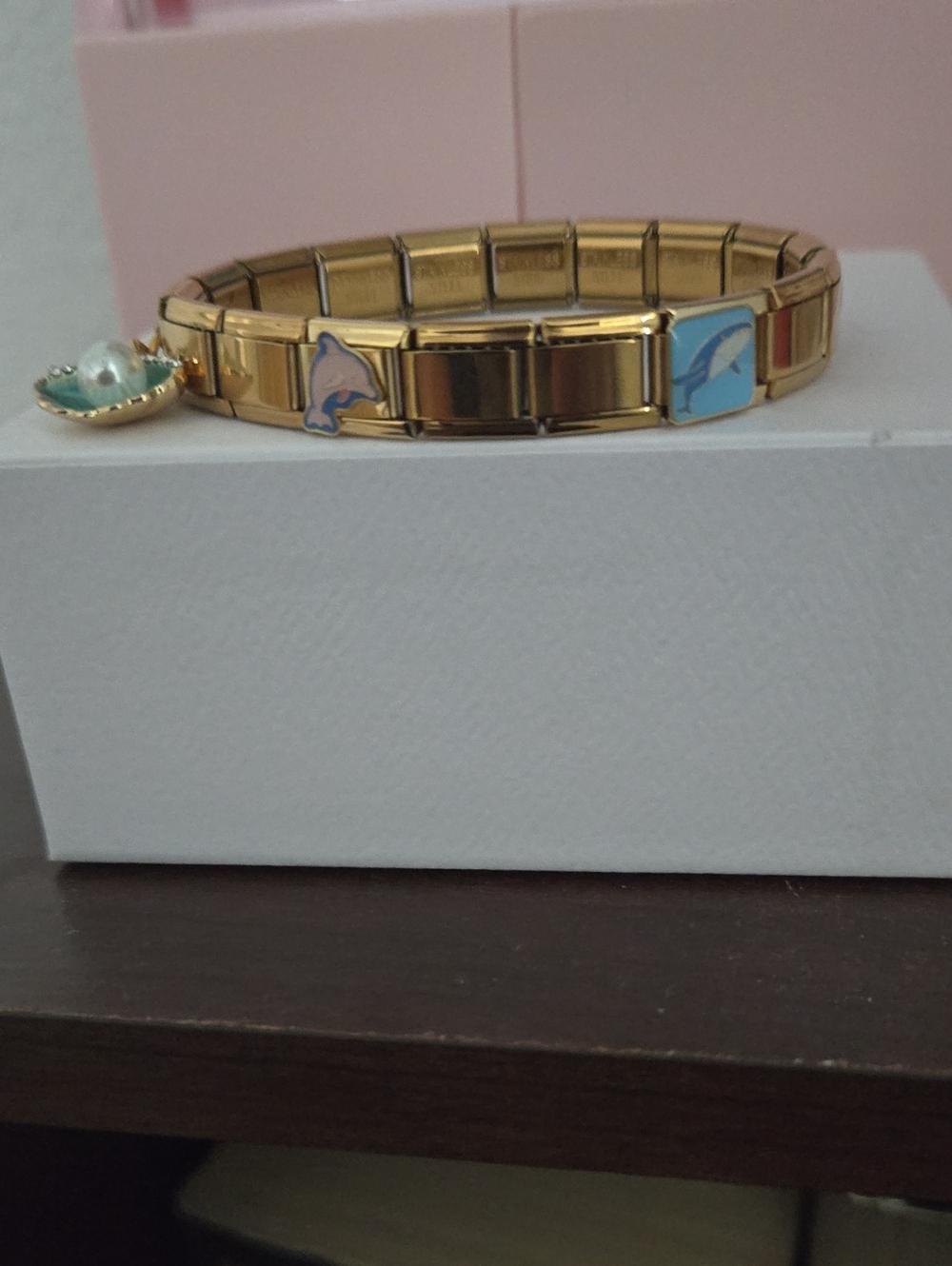 Bella Vita Gold Stretch Bracelet with Blue Dolphin and Pink Accent Charms